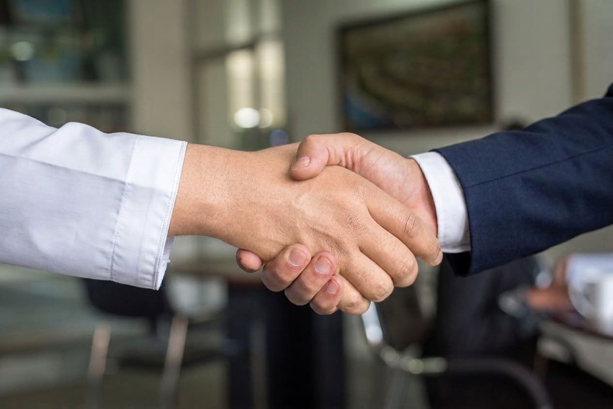 Business partners shaking hands